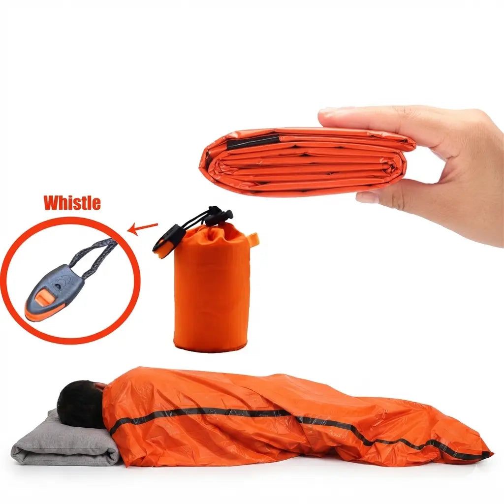 A man sleeping in the emergency sleeping bag and a display of the packaging and whistle on a white background