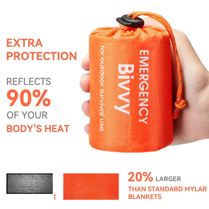 A hand holding the sleeping bag with specifications on the background